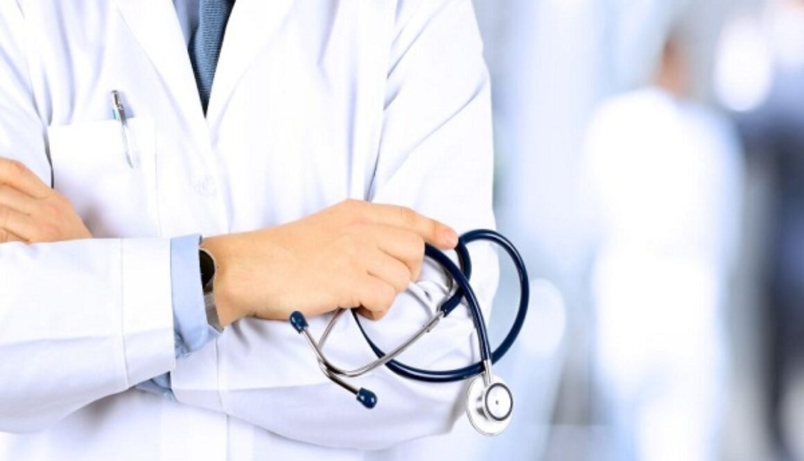 Portrait an unknown male doctor holding a stethoscope behind